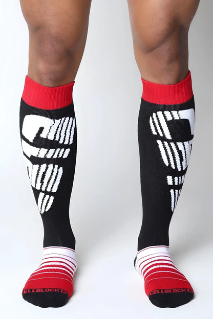 Velocity 2.0 black knee high socks with white cellblock 13 logo and red ribbed cuffs and toe sections