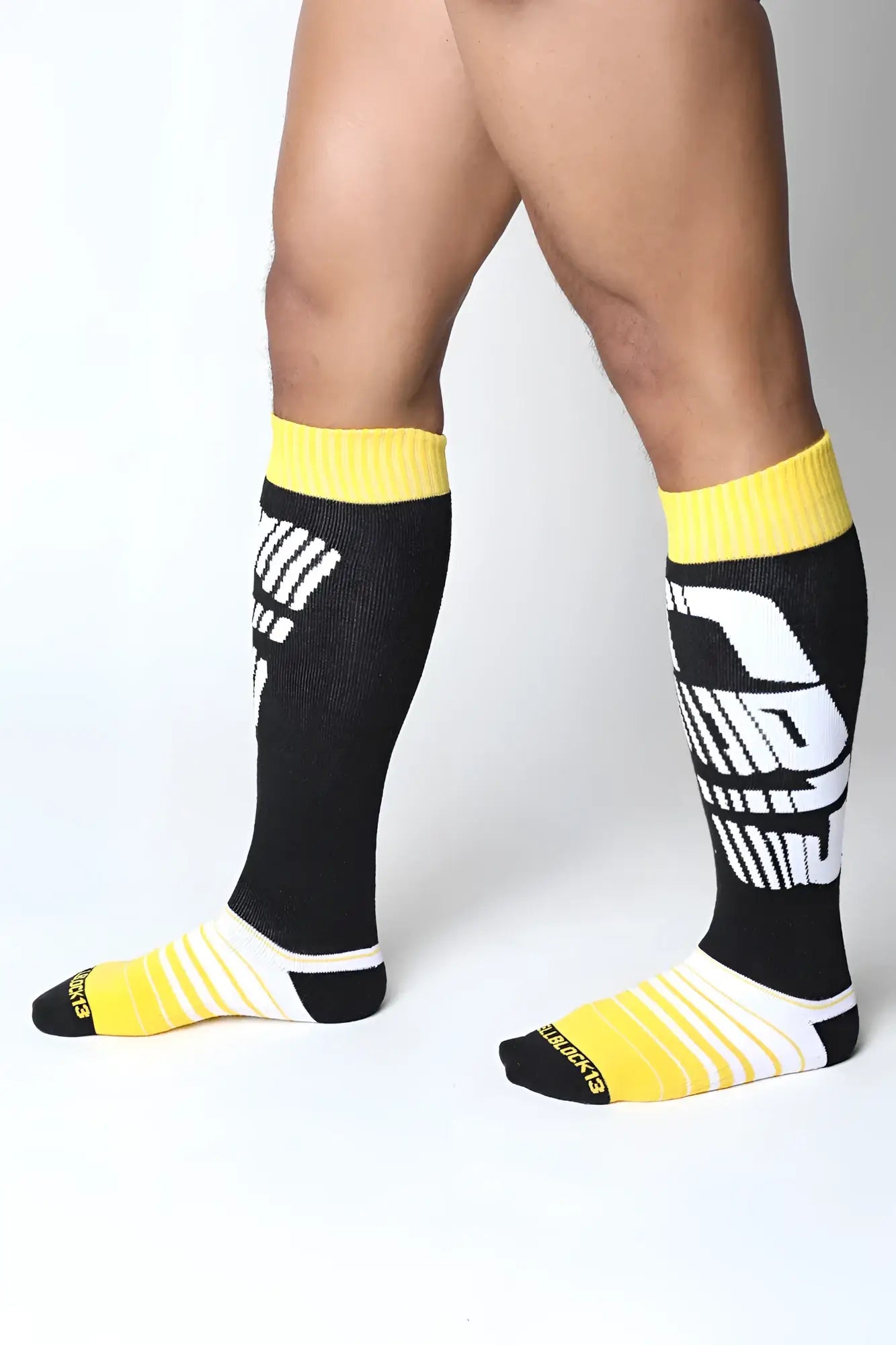 Velocity 2.0 knee high socks in black and yellow with bold white graphic design perfect for athletic use