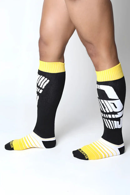 Velocity 2.0 knee high socks in black and yellow with bold white graphic design perfect for athletic use