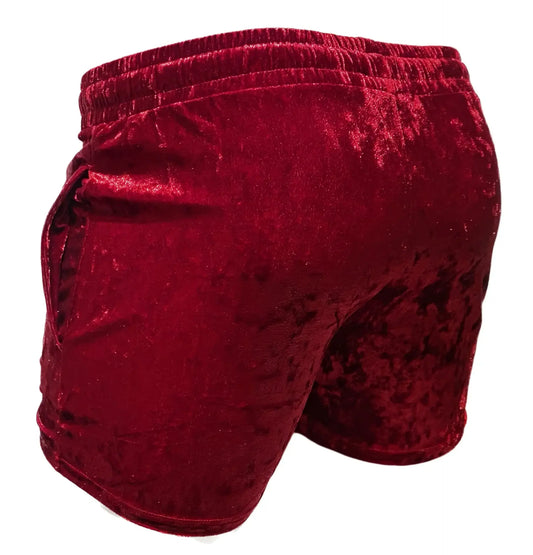 Rich burgundy velvet pocket shorts with plush textured fabric and elastic waistband for comfortable wear