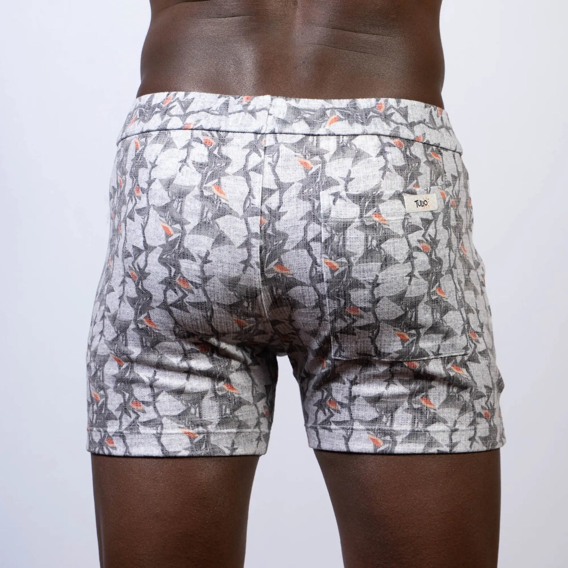 Vintage stripes linen texture shorts in gray and white pattern with subtle orange accent and elastic waistband