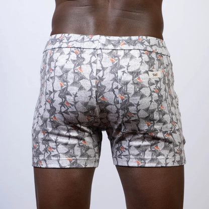 Vintage stripes linen texture shorts in gray and white pattern with subtle orange accent and elastic waistband