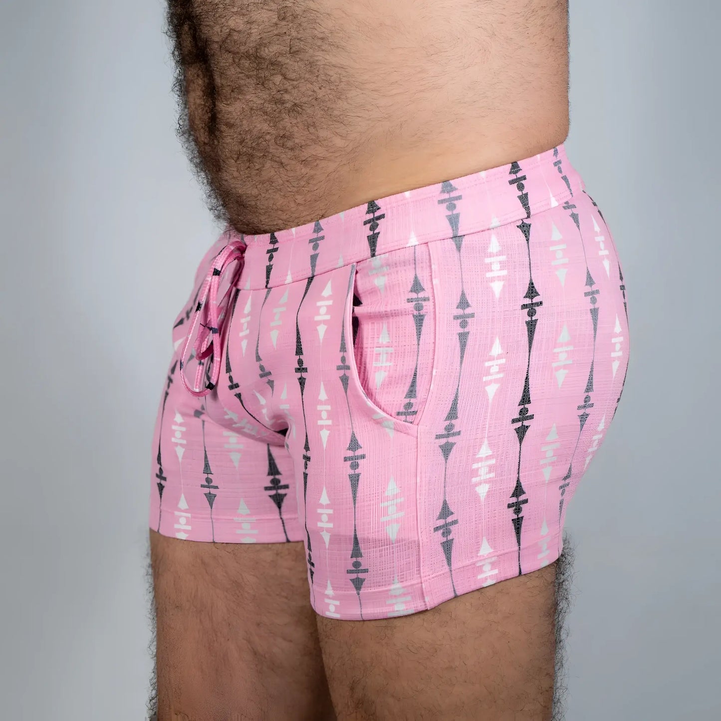 Pink wallpaper print linen texture shorts with black and white geometric pattern side pockets and drawstring waistband