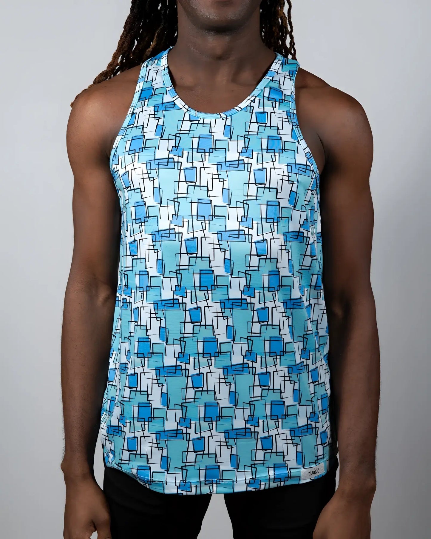 A men’s tank top with a vibrant blue geometric wallpaper print on a white background for casual wear