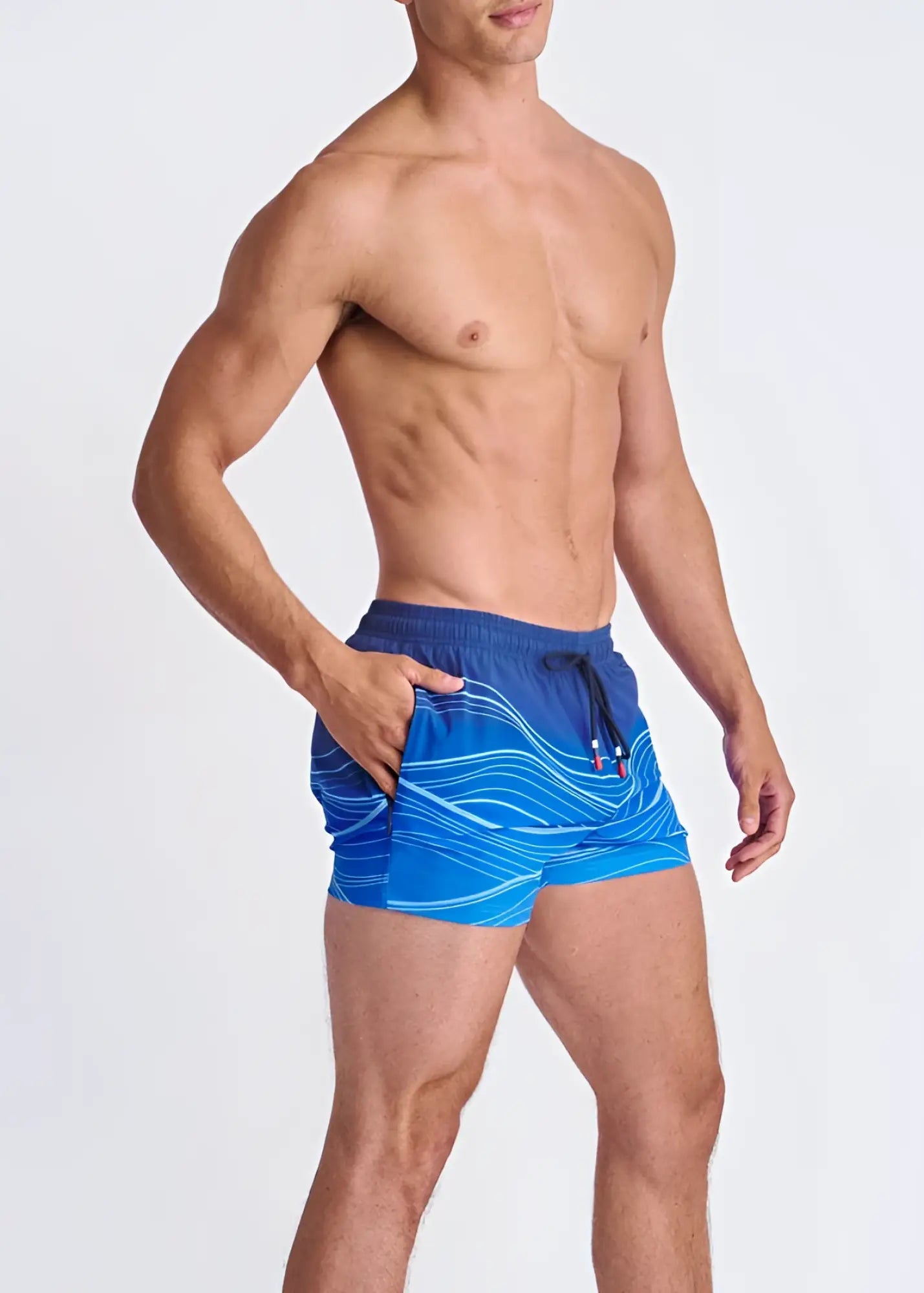 Blue waves print swim shorts with white wavy patterns black drawstring waistband and mesh lining for swimming
