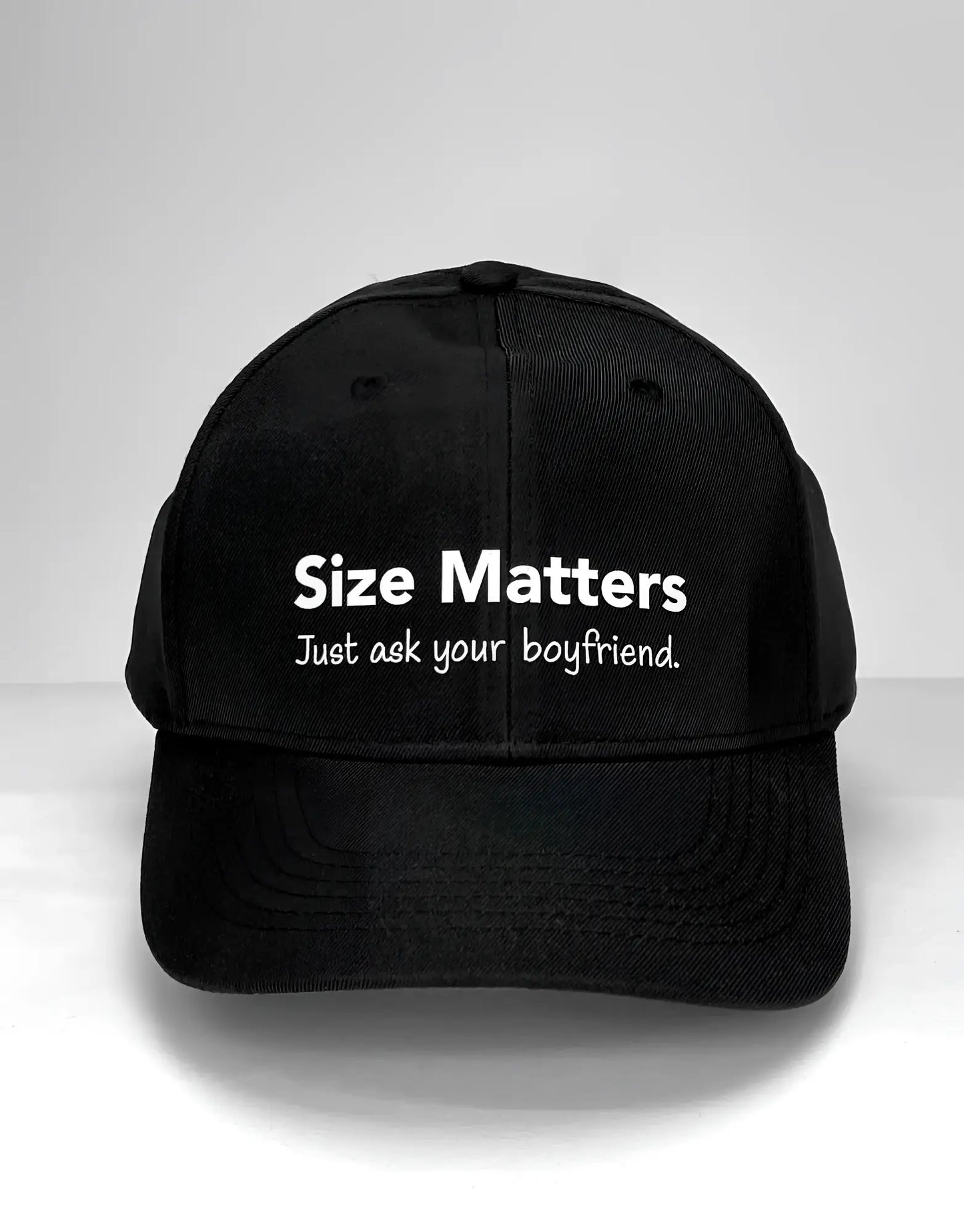 Black WildmanT baseball cap with white embroidered size matters just ask your boyfriend text on the front