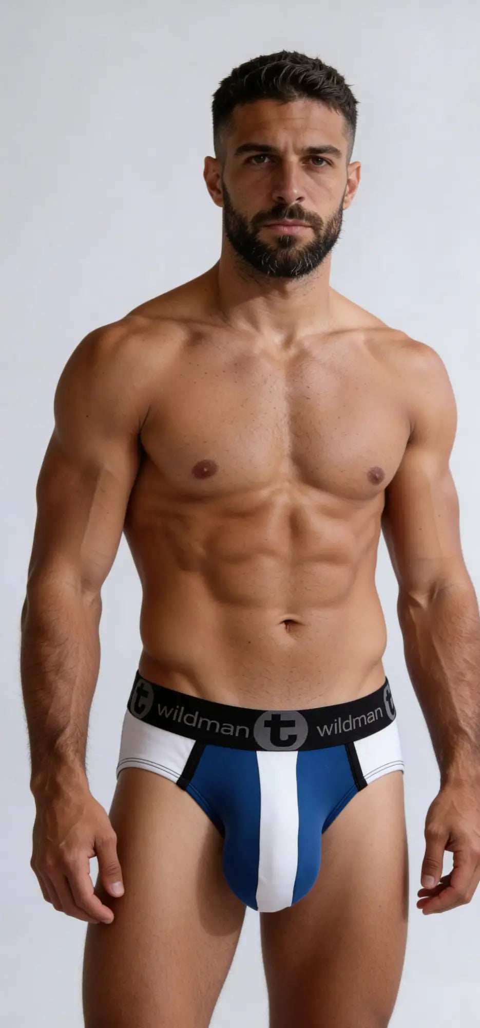 Big Boy Pouch Brief in blue and white stripes with a branded black waistband on a muscular man.