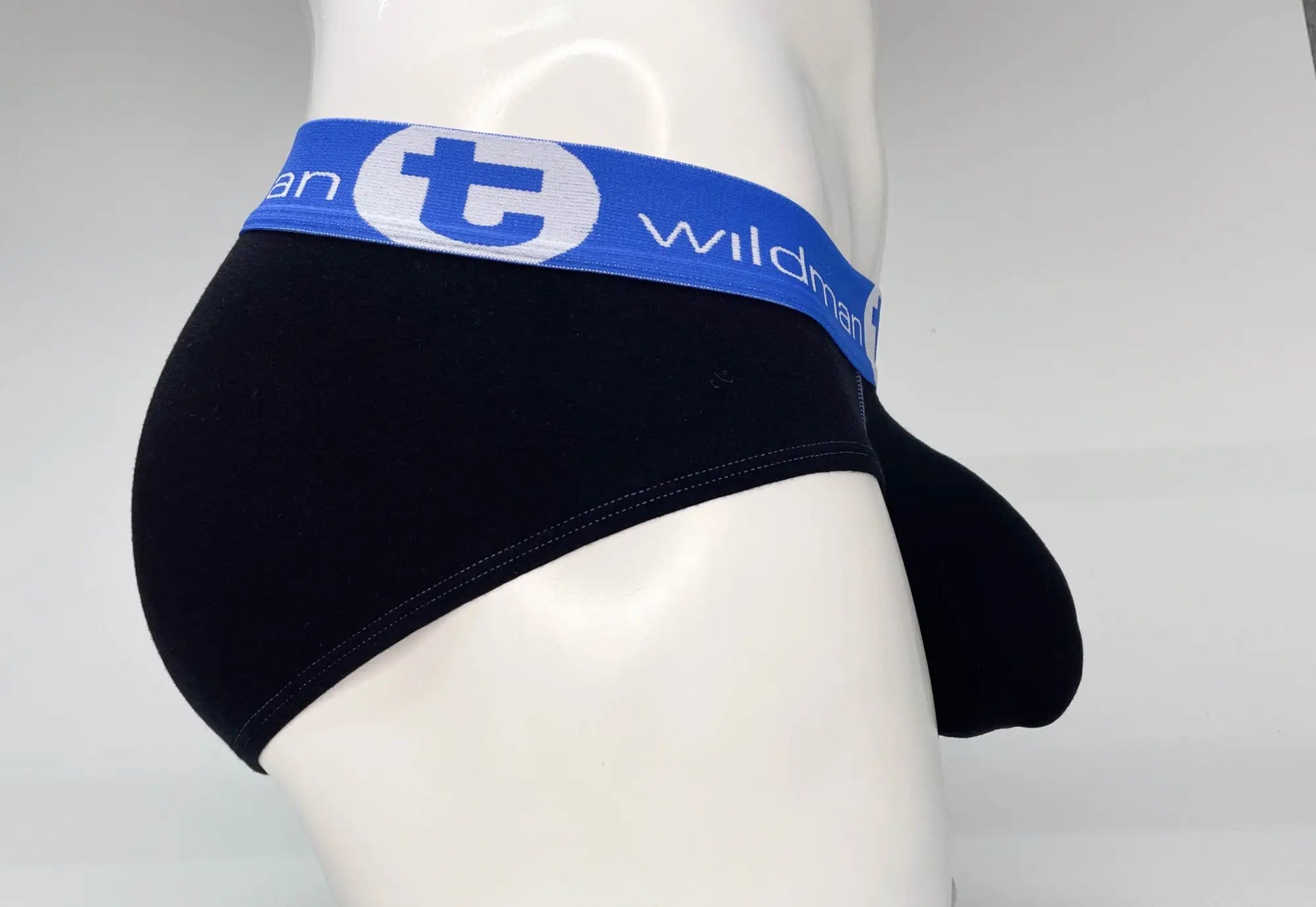 Black big boy pouch cotton briefs with blue elastic waistband and wildman logo white lettering
