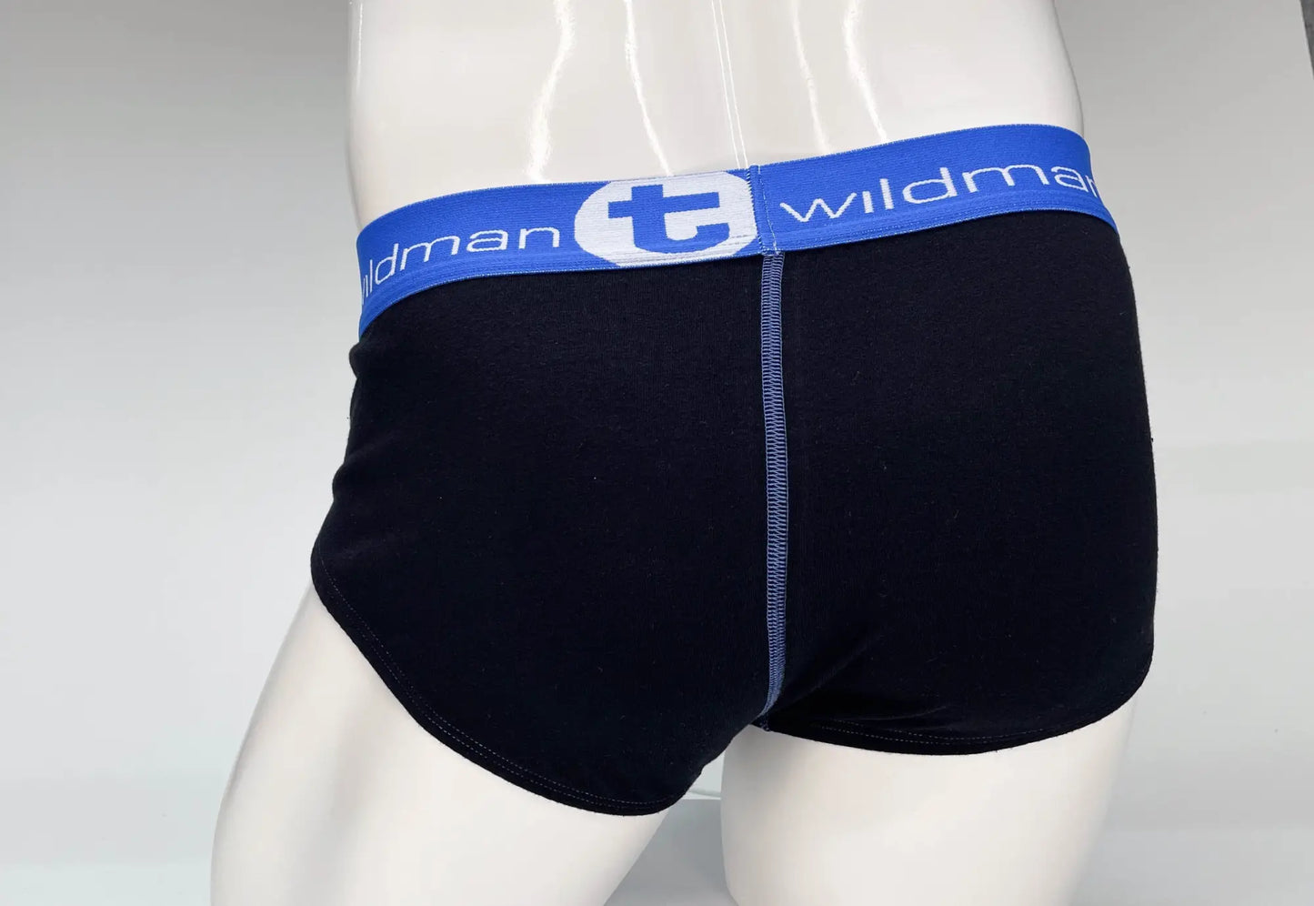 Black cotton briefs with blue waistband and white wildman logo featuring big boy pouch design