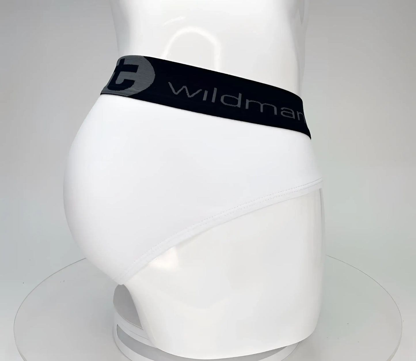 White cotton briefs with black elastic waistband and wildman branding in gray from wildmant big boy pouch series