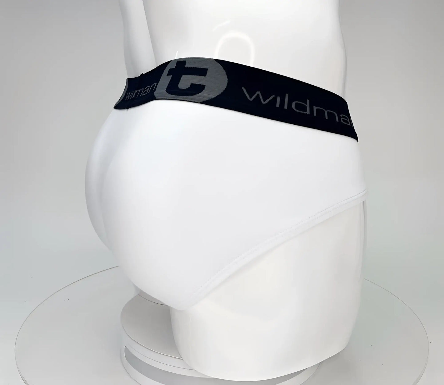 White cotton wildmant big boy pouch brief with black elastic waistband and gray wildman logo lettering