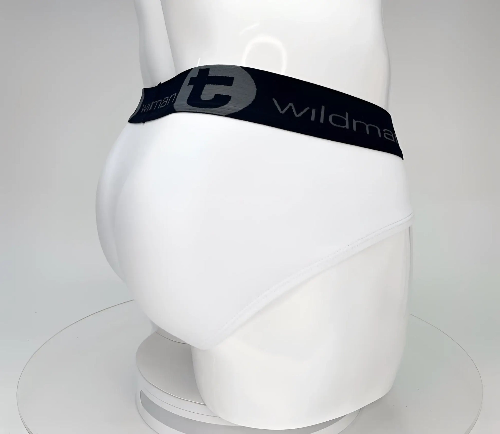 White cotton wildmant big boy pouch brief with black elastic waistband and gray wildman logo lettering