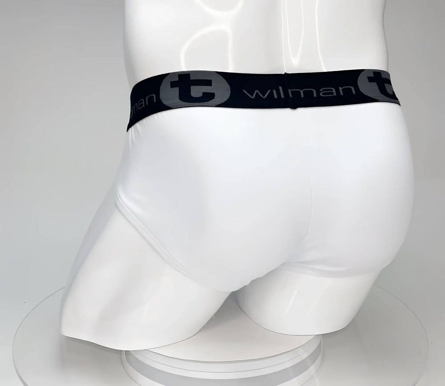 White cotton wildmant big boy pouch brief with black elastic waistband featuring wilman brand name and logo