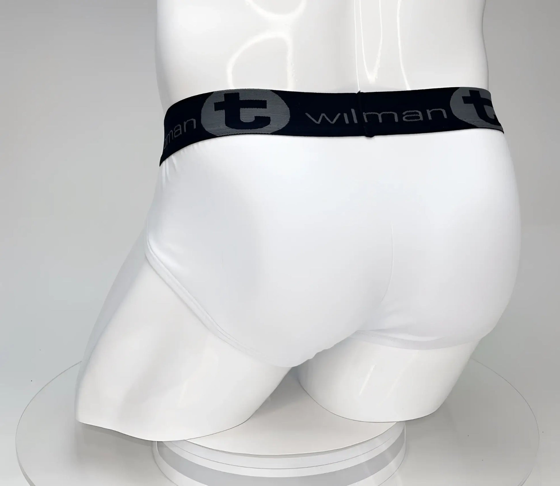 White cotton wildmant big boy pouch brief with black elastic waistband featuring wilman brand name and logo