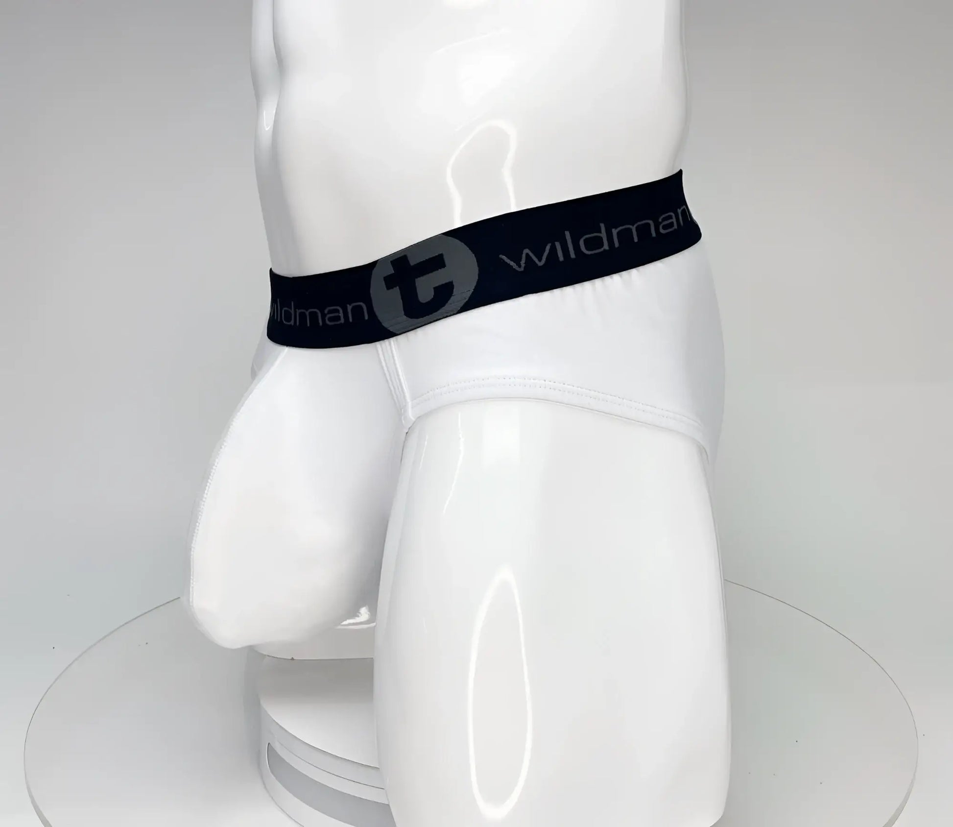 White wildmanT big boy pouch cotton briefs with black elastic waistband featuring wildman logo and stylized t emblem