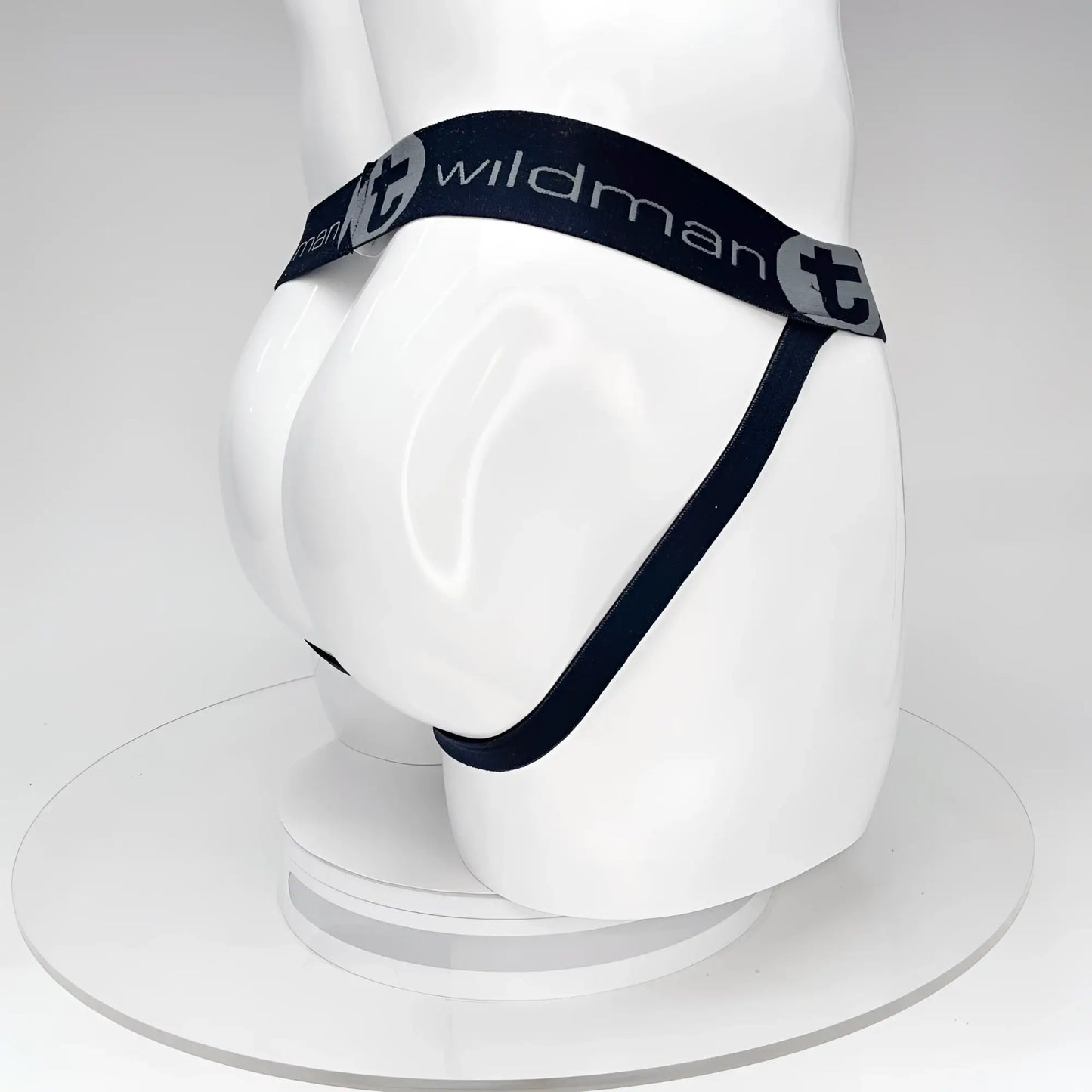 Wildmant big boy pouch jockstrap black with black elastic waistband and white wildman branding on a mannequin