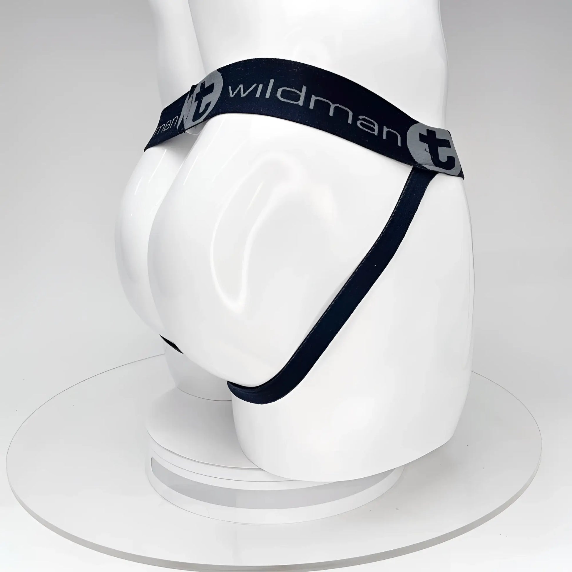 Wildmant big boy pouch jockstrap black with black elastic waistband and white wildman branding on a mannequin