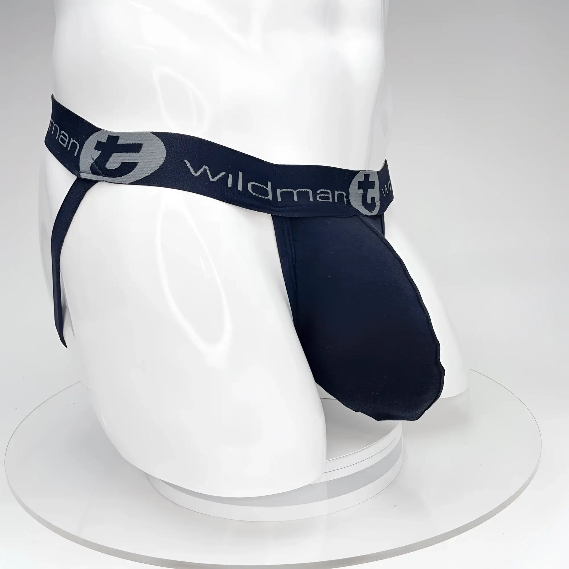 Navy blue wildman brand jockstrap with elastic waistband and logo detailing featuring a big boy pouch design