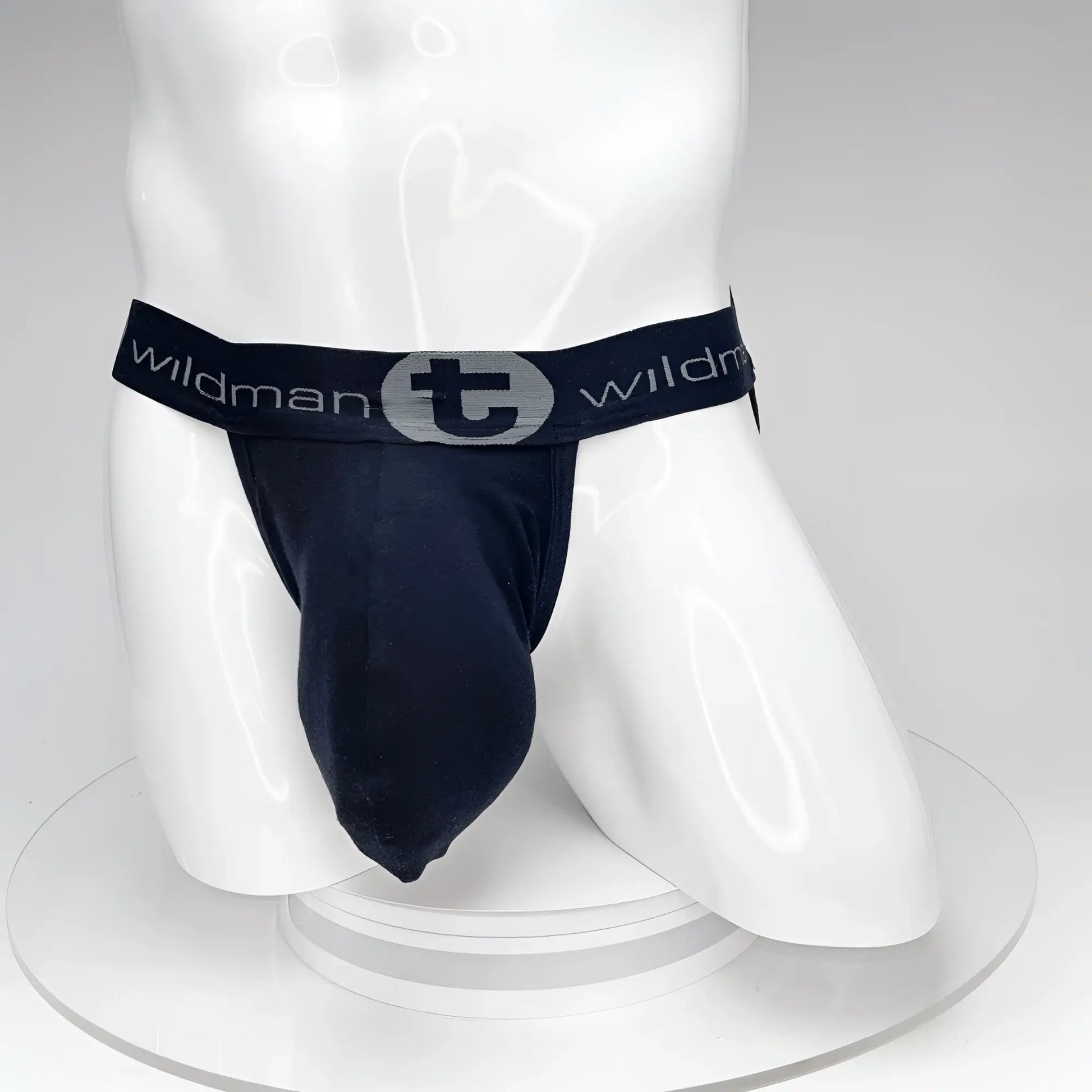 Black wildman big boy pouch jockstrap featuring a textured elastic waistband with wildman logo and stylized t emblem