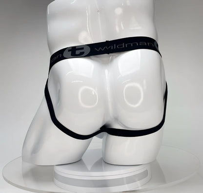 Wildmant big boy pouch jockstrap white with black elastic waistband featuring wildman branding on a white mannequin