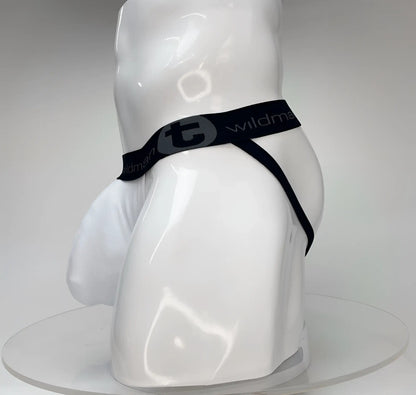 WildmanT Big Boy white jockstrap with a large pouch and black branded elastic waistband on a white mannequin.