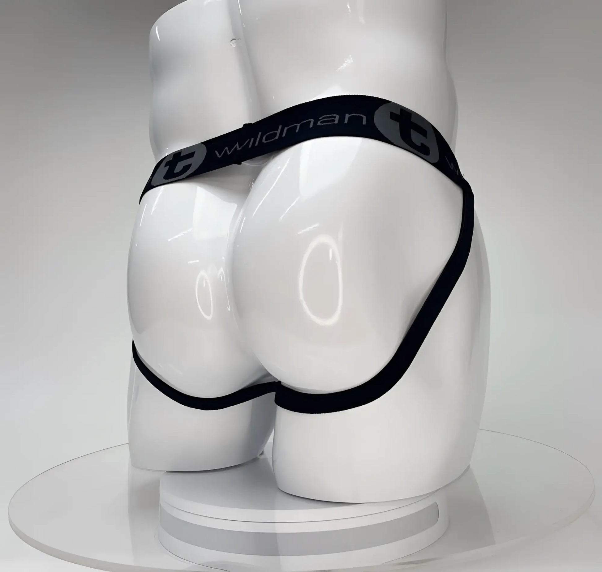 Wildmant big boy pouch jockstrap white with black elastic waistband and wildman branding on a white mannequin