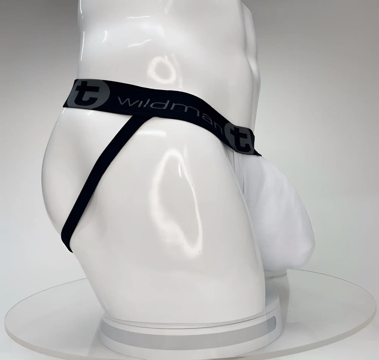 WildmanT big boy pouch jockstrap white with black elastic waistband featuring wildman branding on white mannequin