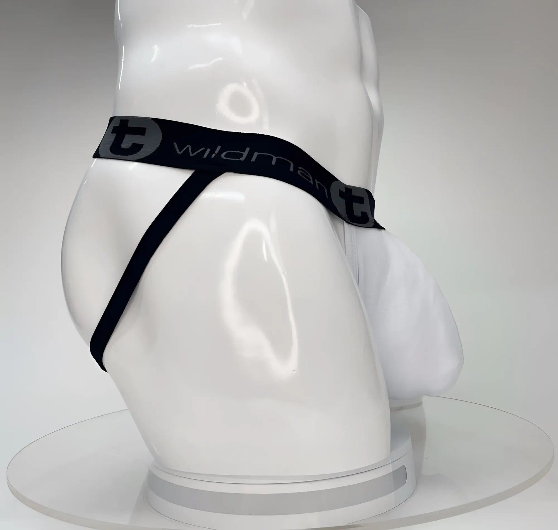 WildmanT big boy pouch jockstrap white with black elastic waistband featuring wildman branding on white mannequin