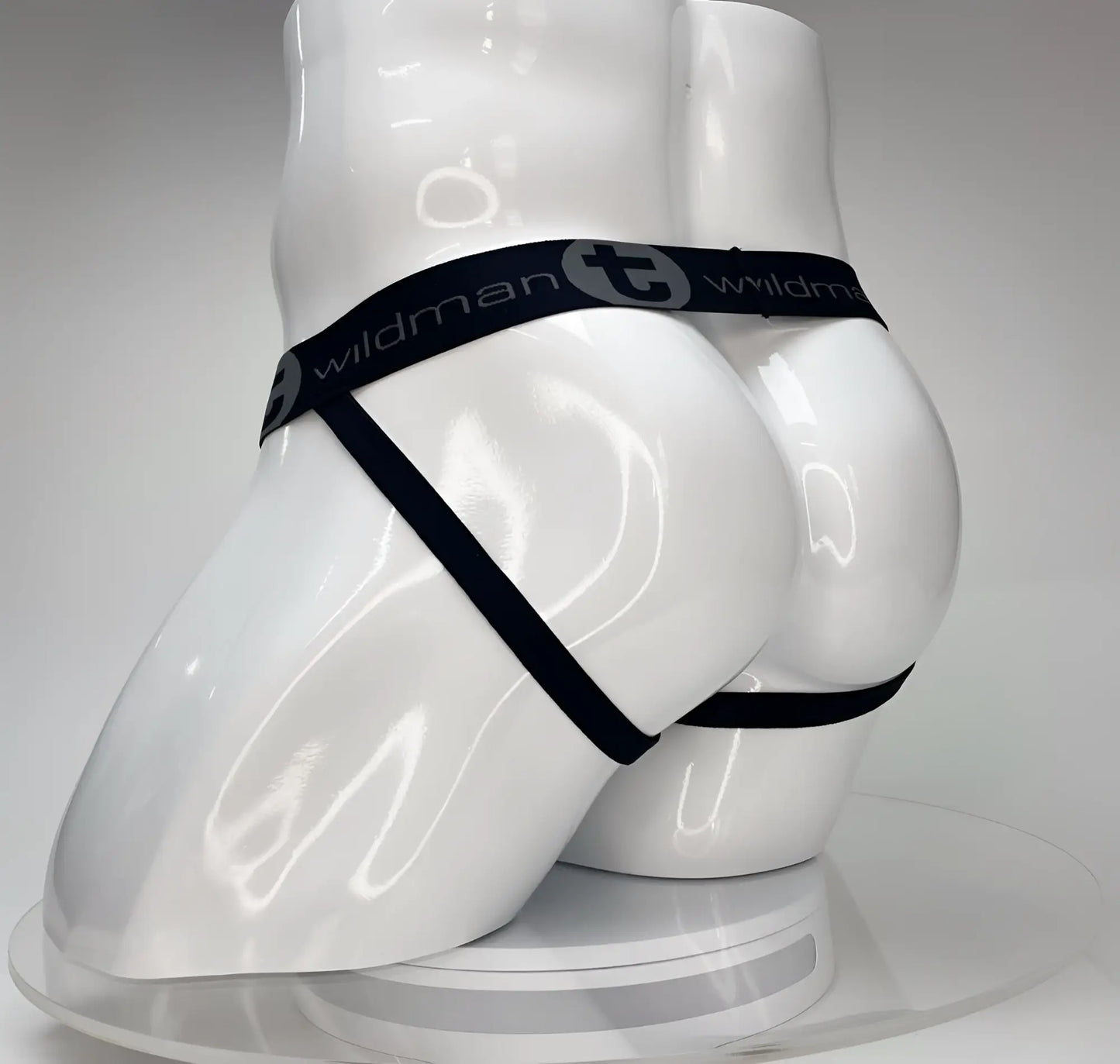 Wildmant big boy pouch jockstrap white with black elastic waistband and wildman branding worn by white mannequin