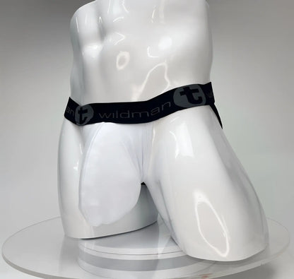 White WildmanT Big Boy pouch jockstrap on a glossy white mannequin, featuring a black branded waistband.