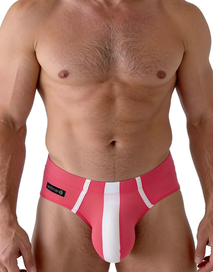Modal briefs in pink and white with a central vertical white stripe and "wildman" logo tag on the hip.
