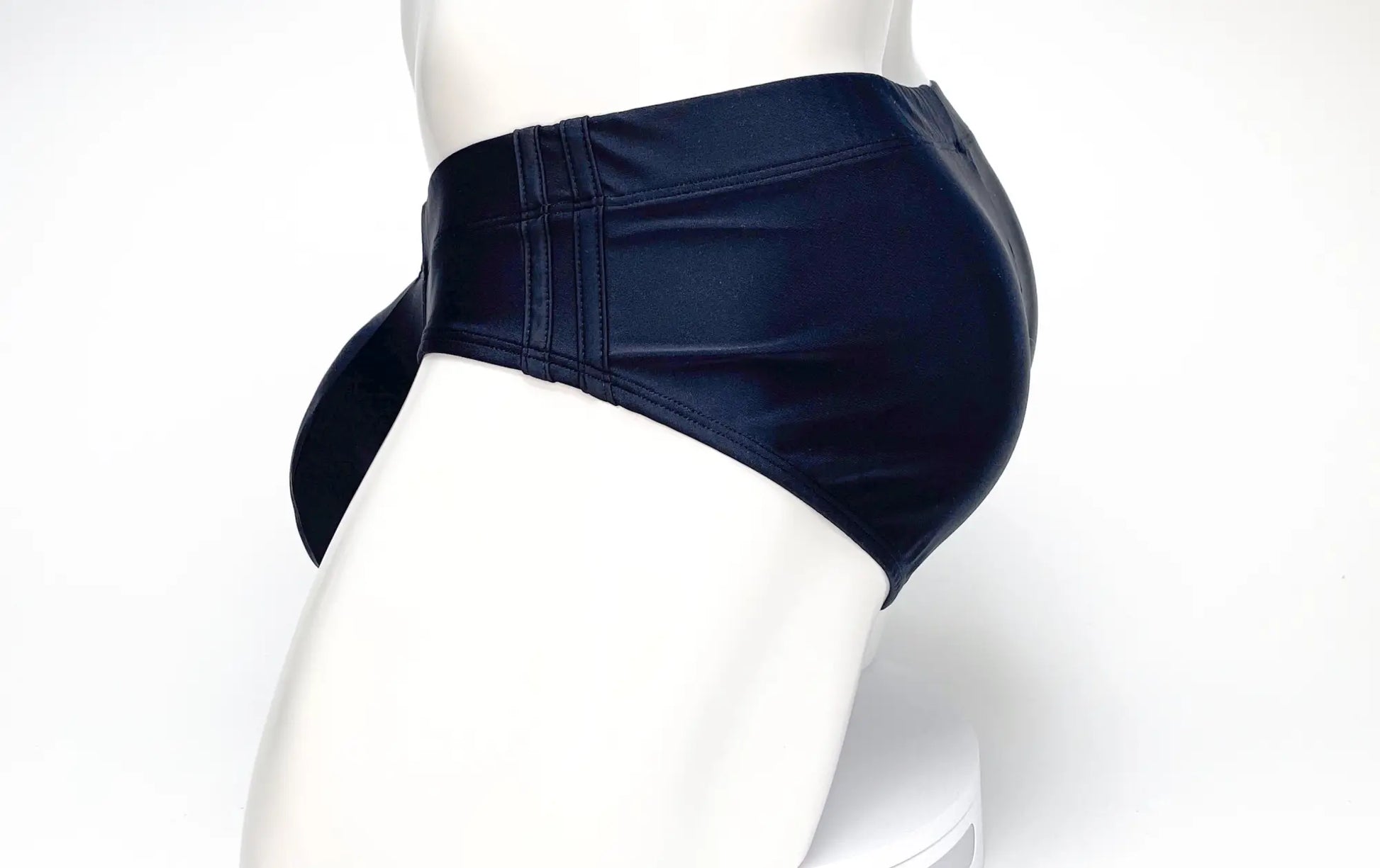 Navy blue faux leather high-waisted WildmanT Big Boy Pouch swim briefs with side ties for men