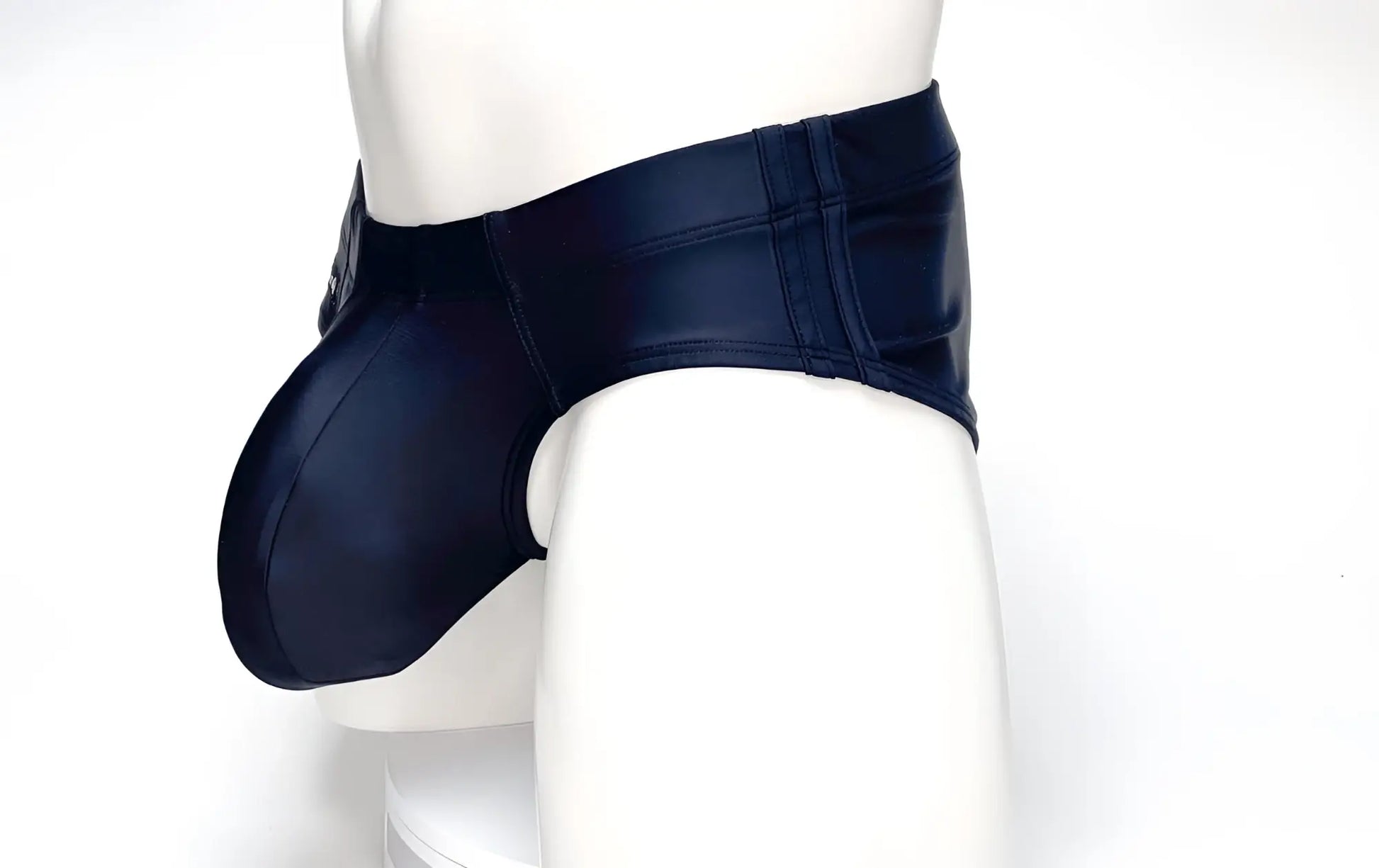 WildmanT black swim brief on a mannequin, featuring a contoured, spacious front pouch and wide side panels.