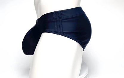 Side view of a black WildmanT Big Boy pouch swim brief on a mannequin, featuring a prominent front pouch and side seams.