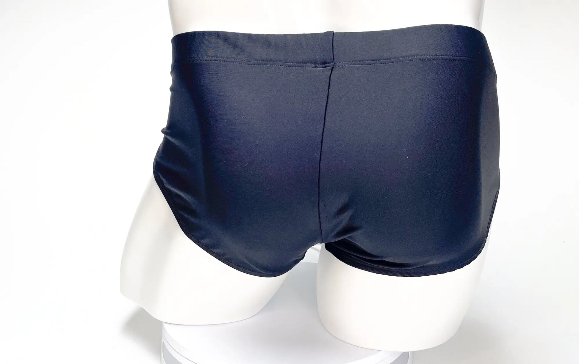 WildmanT big boy pouch swim brief in navy blue with a smooth glossy finish and a tailored cut for swimwear