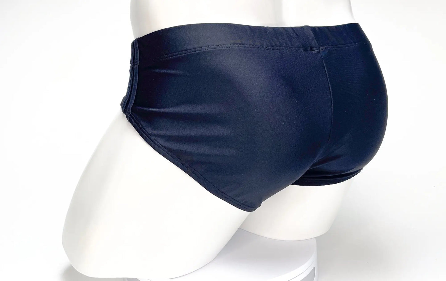 WildmanT big boy pouch swim brief in navy blue with smooth glossy finish and elastic waistband for swimwear use