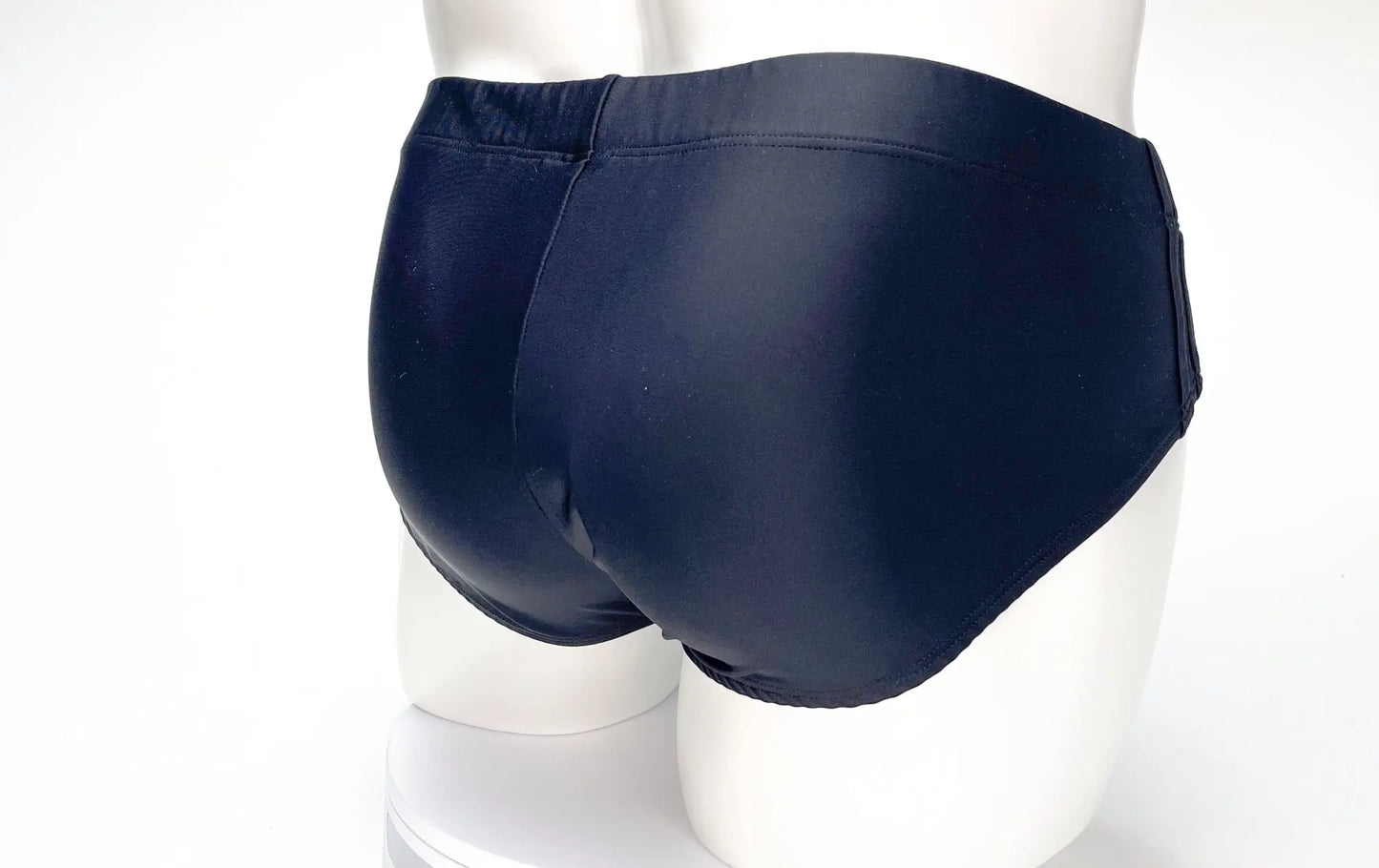 WildmanT big boy pouch swim brief in black with shiny smooth form-fitting design for swimming and beachwear