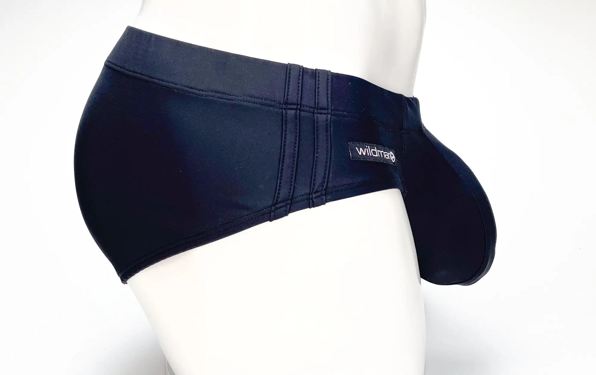 Wildmant big boy pouch swim brief in black with contoured design black stretchy swim trunks featuring wildcraft branding