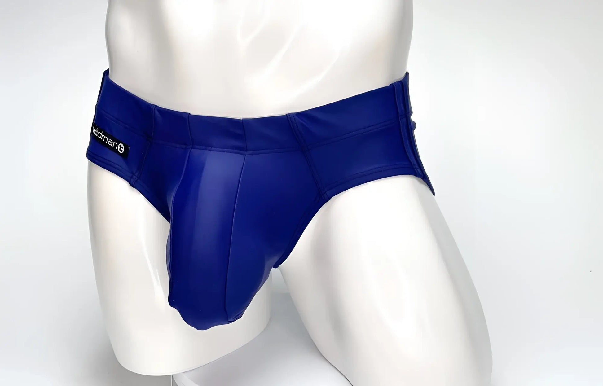 WildmanT navy blue Big Boy Pouch swim brief on a white mannequin, featuring a prominent front pouch and side branding.