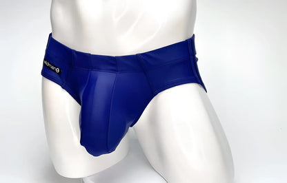 WildmanT navy blue Big Boy Pouch swim brief on a white mannequin, featuring a prominent front pouch and side branding.