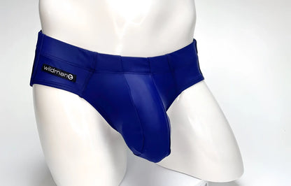 WildmanT navy blue swim brief with a prominent contoured pouch and a small logo tag on the side, on a mannequin.
