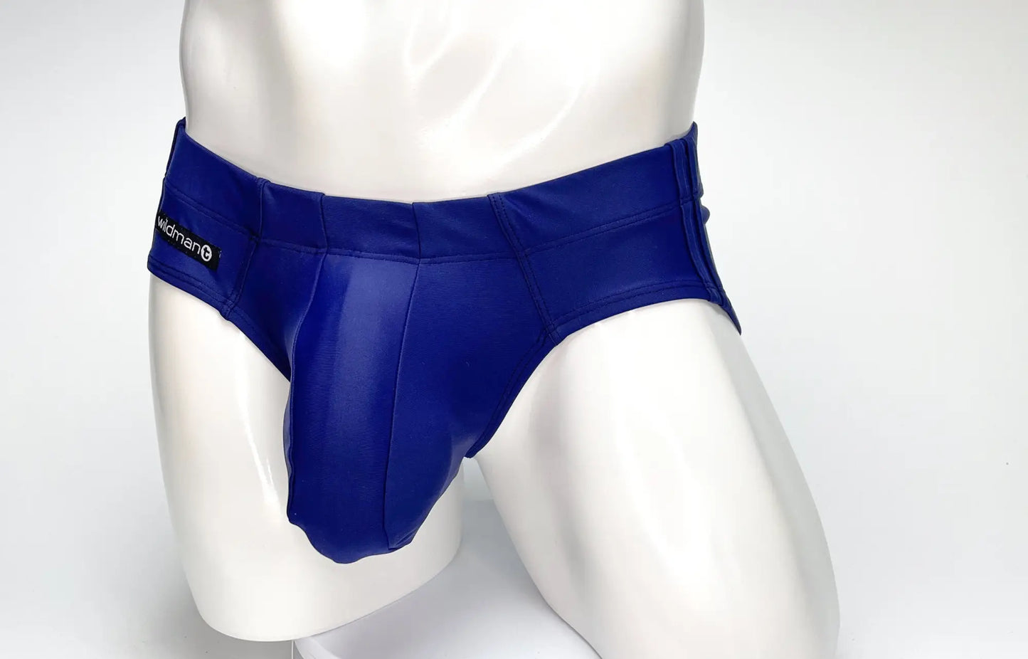 Royal blue glossy faux leather WildmanT big boy pouch swim briefs with sleek fit and black brand tag on waistband