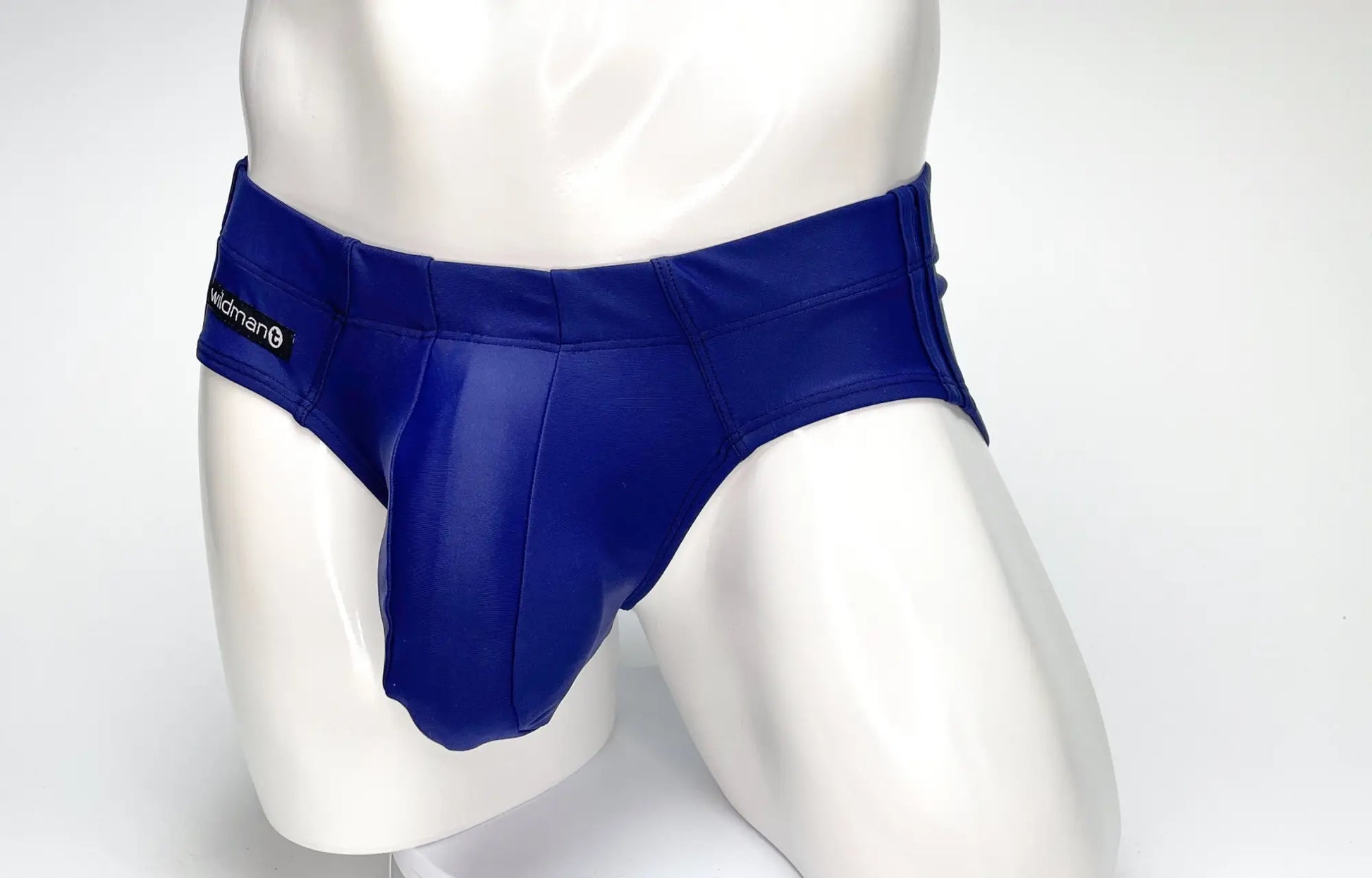 Royal blue glossy faux leather WildmanT big boy pouch swim briefs with sleek fit and black brand tag on waistband