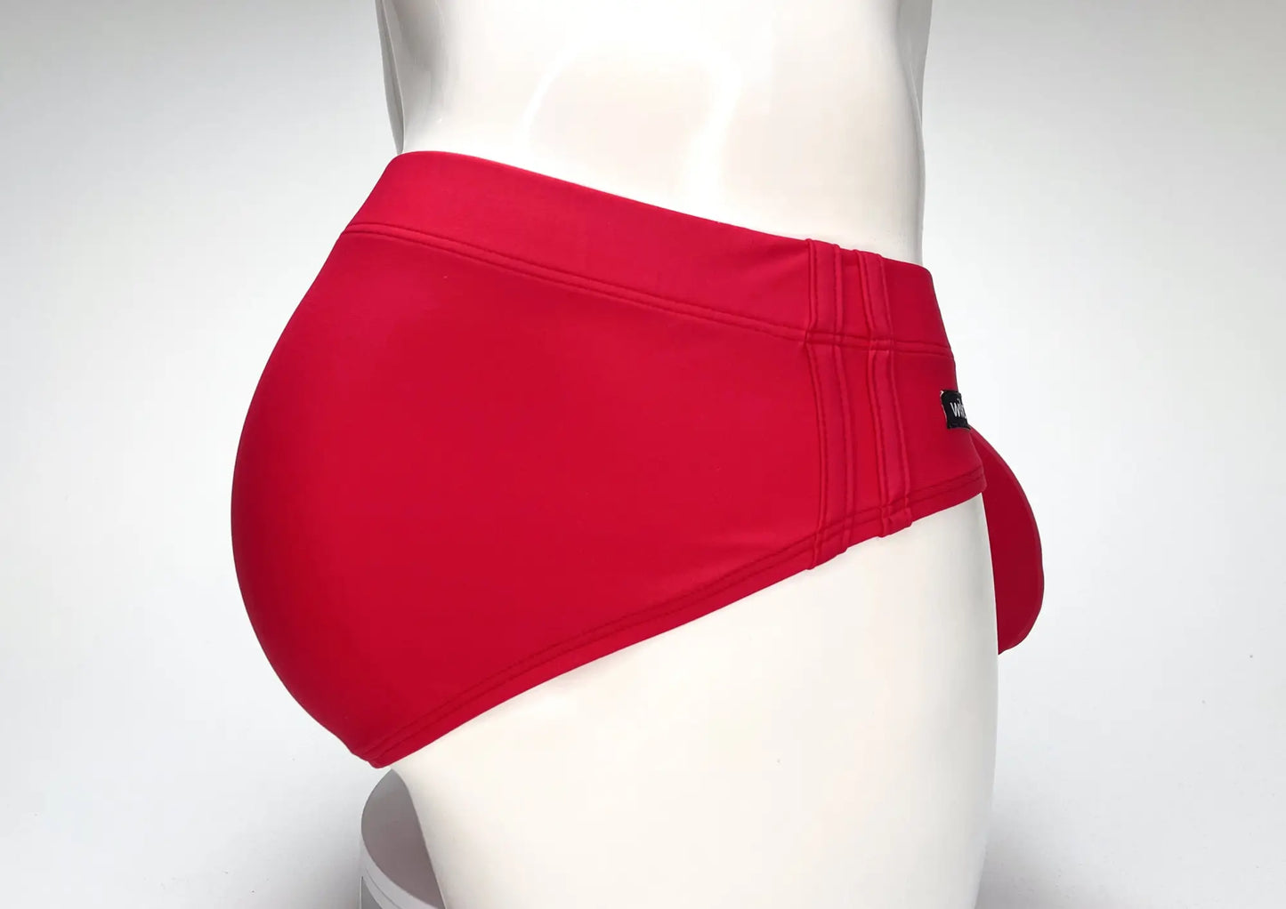 Wildmant big boy pouch swim brief in red with snug fit and elastic waistband displayed on a mannequin