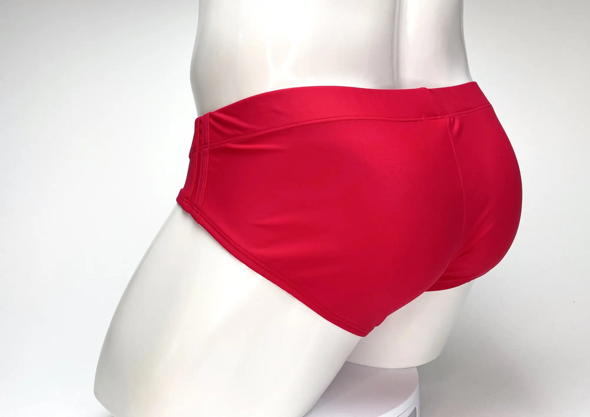 Bright red wildmant big boy pouch swim brief with a smooth satin-like finish for comfortable swimwear use