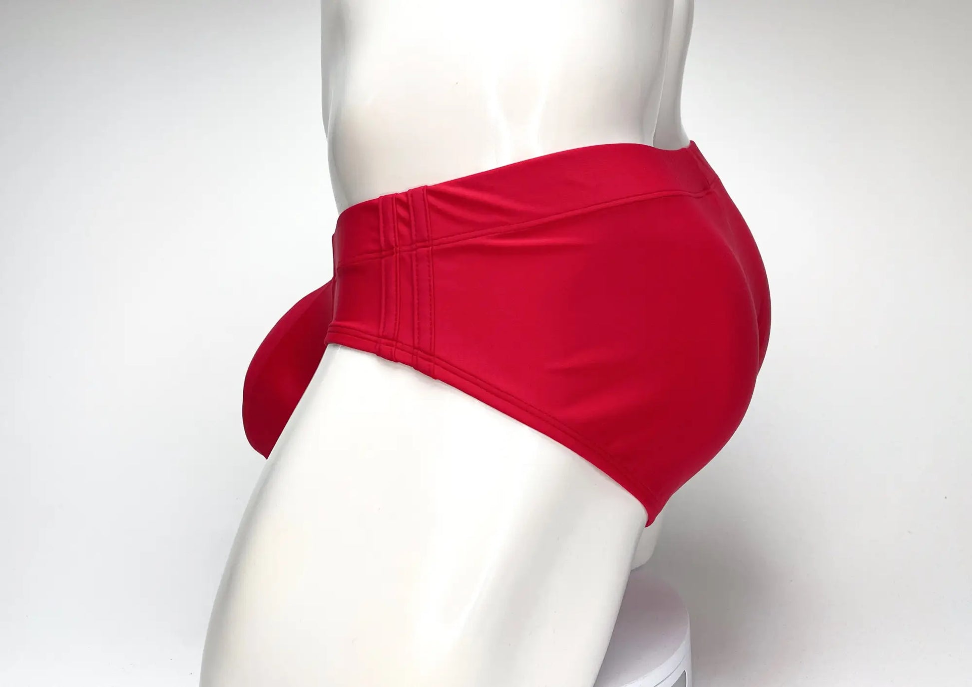 WildmanT big boy pouch swim brief red in red high waisted fabric with tied side detail for comfortable wear