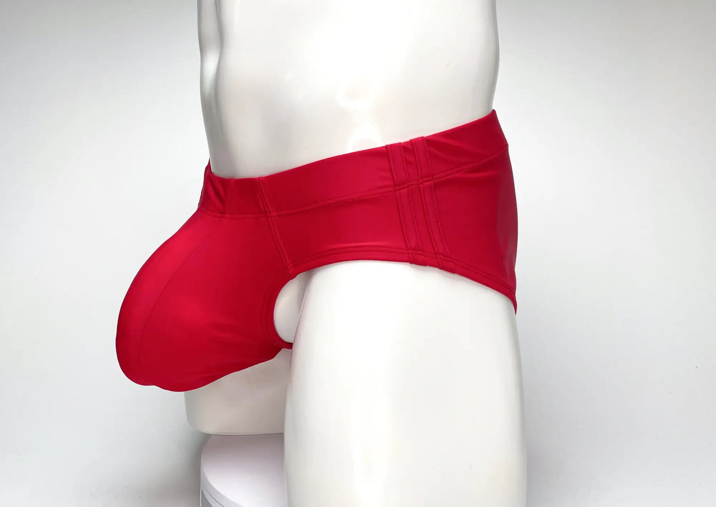 WildmanT big boy pouch swim brief in red with smooth form-fitting fabric and subtle vertical stitching on waistband