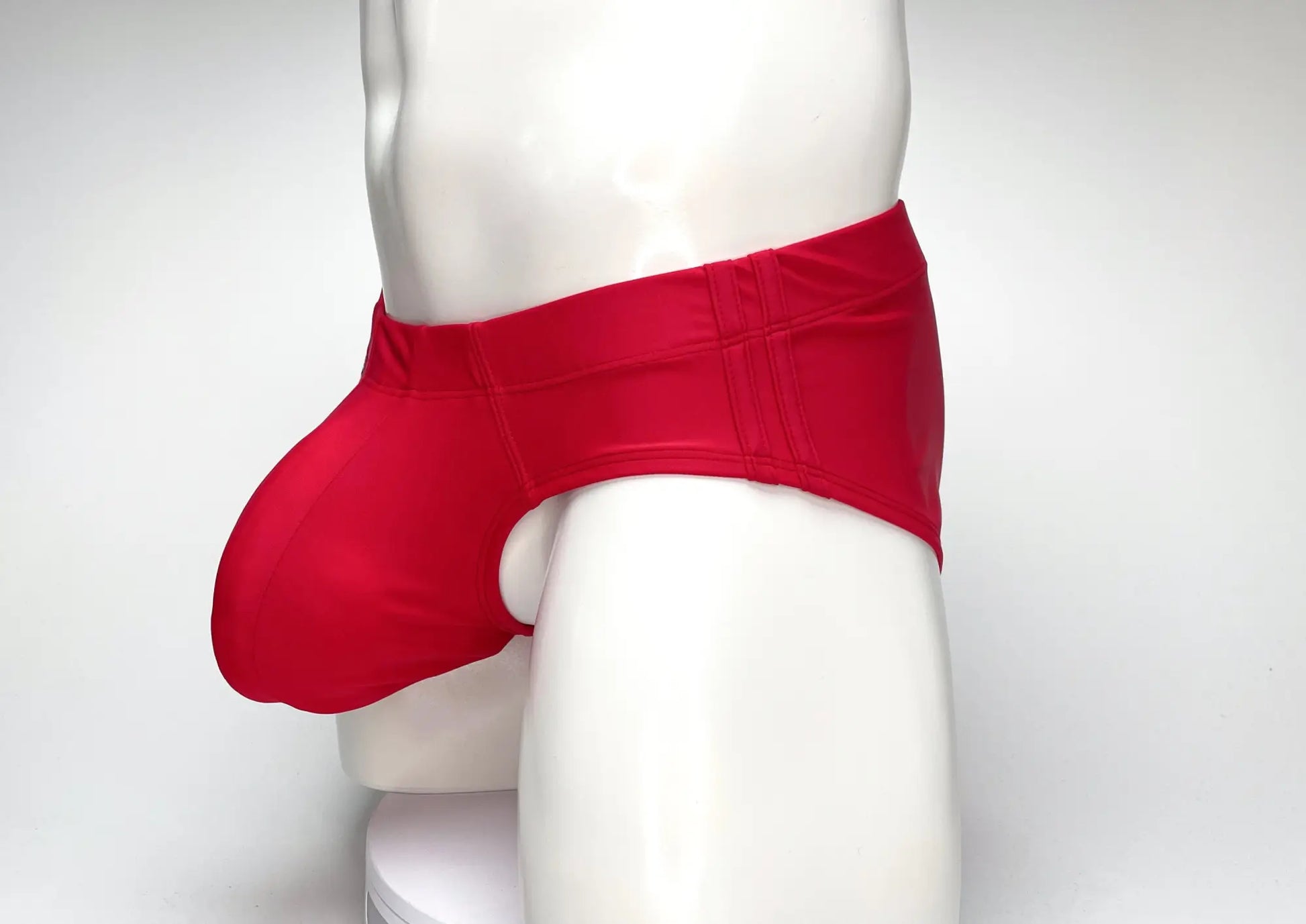 WildmanT big boy pouch swim brief in red with smooth form-fitting fabric and subtle vertical stitching on waistband