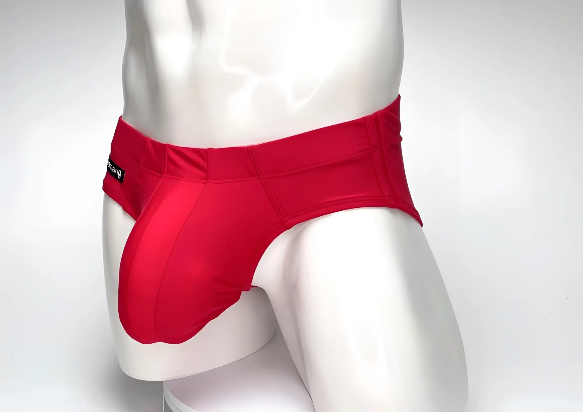 WildmanT Big Boy red swim brief featuring a prominent contoured pouch and small branded side label on a white mannequin.
