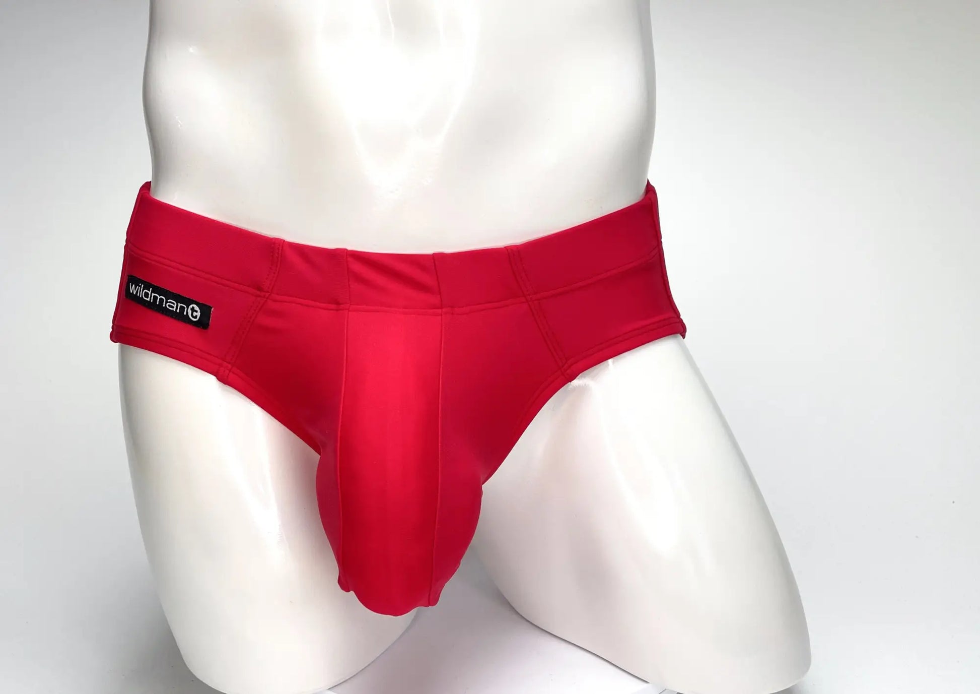 Wildmant big boy pouch swim brief in red featuring smooth form-fitting fabric and a prominent central pouch